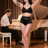 black high waist satin panties worn with a black spiral stitch bra